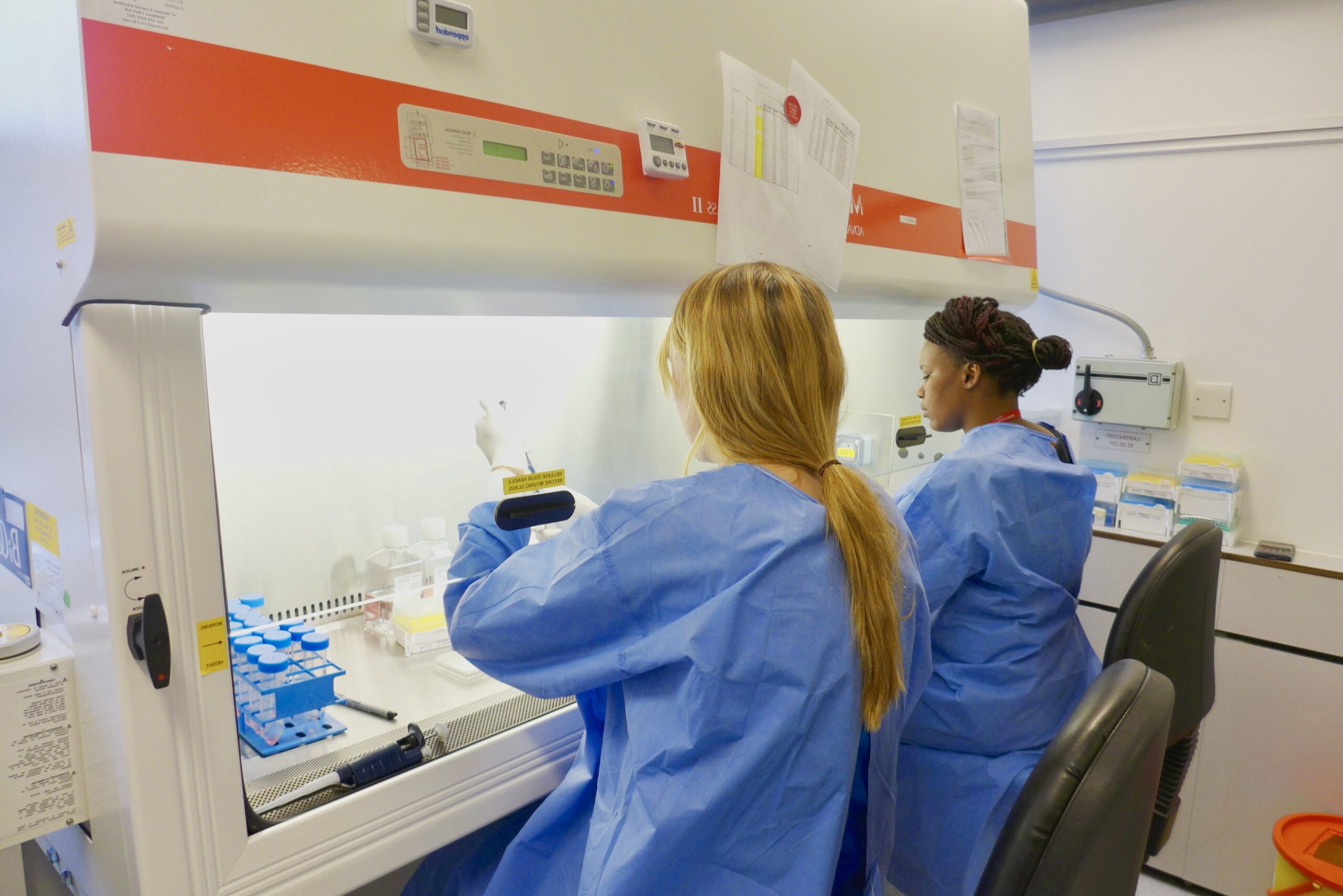 Scientists working at the IAVI Human Immunology Laboratory in London
