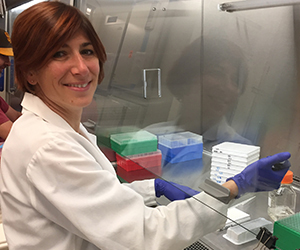 Elise Landais, Ph.D., Principal Scientist, IAVI, works in a lab in La Jolla, California